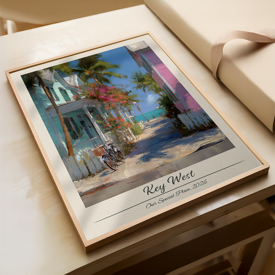 Framed artwork of a street scene with 'Key West' text on a wooden surface