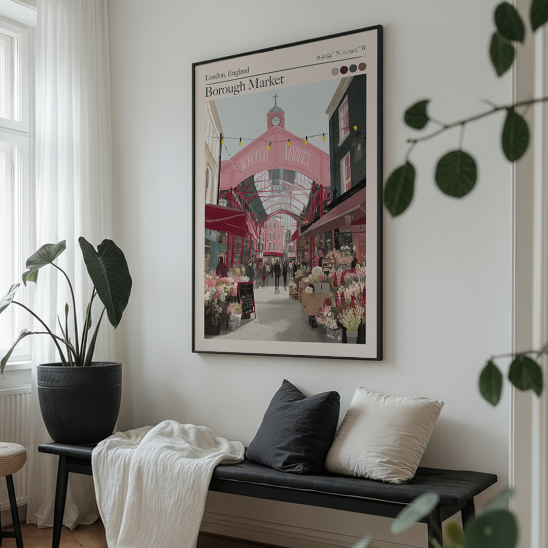 Framed artwork of Borough Market in London on a wall above a bench with cushions.