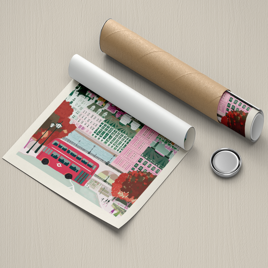 Illustrated poster of a cityscape with a red bus, rolled up and unrolled on a textured surface.
