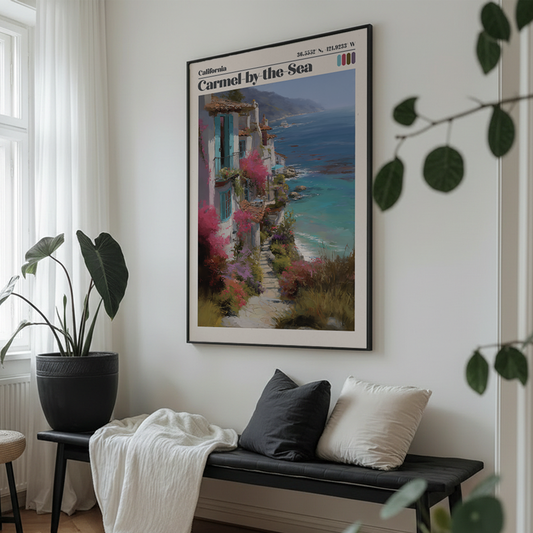 Framed artwork of a coastal scene above a bench in a room with plants.