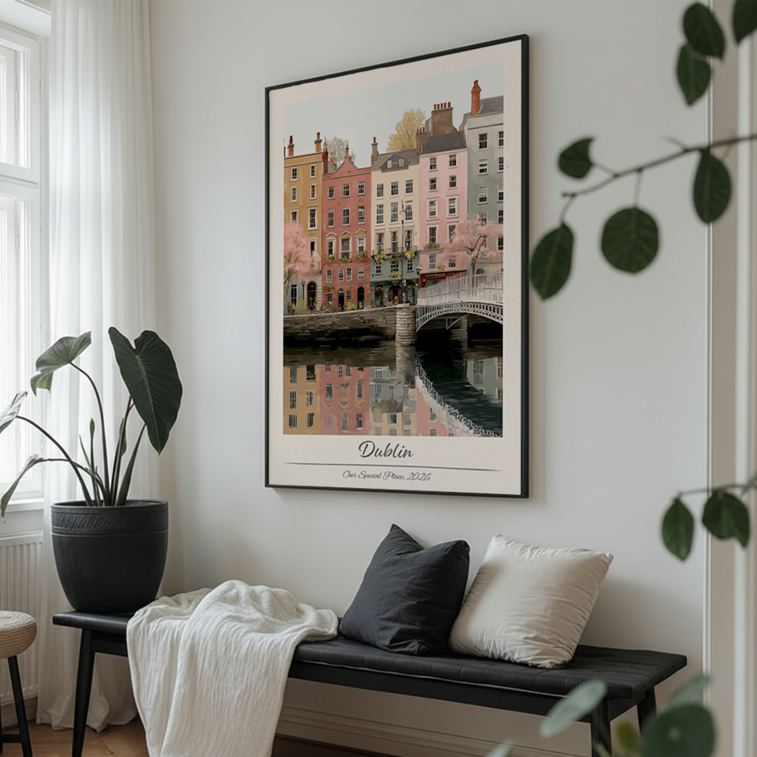 Framed artwork of a cityscape on a wall above a bench with cushions.