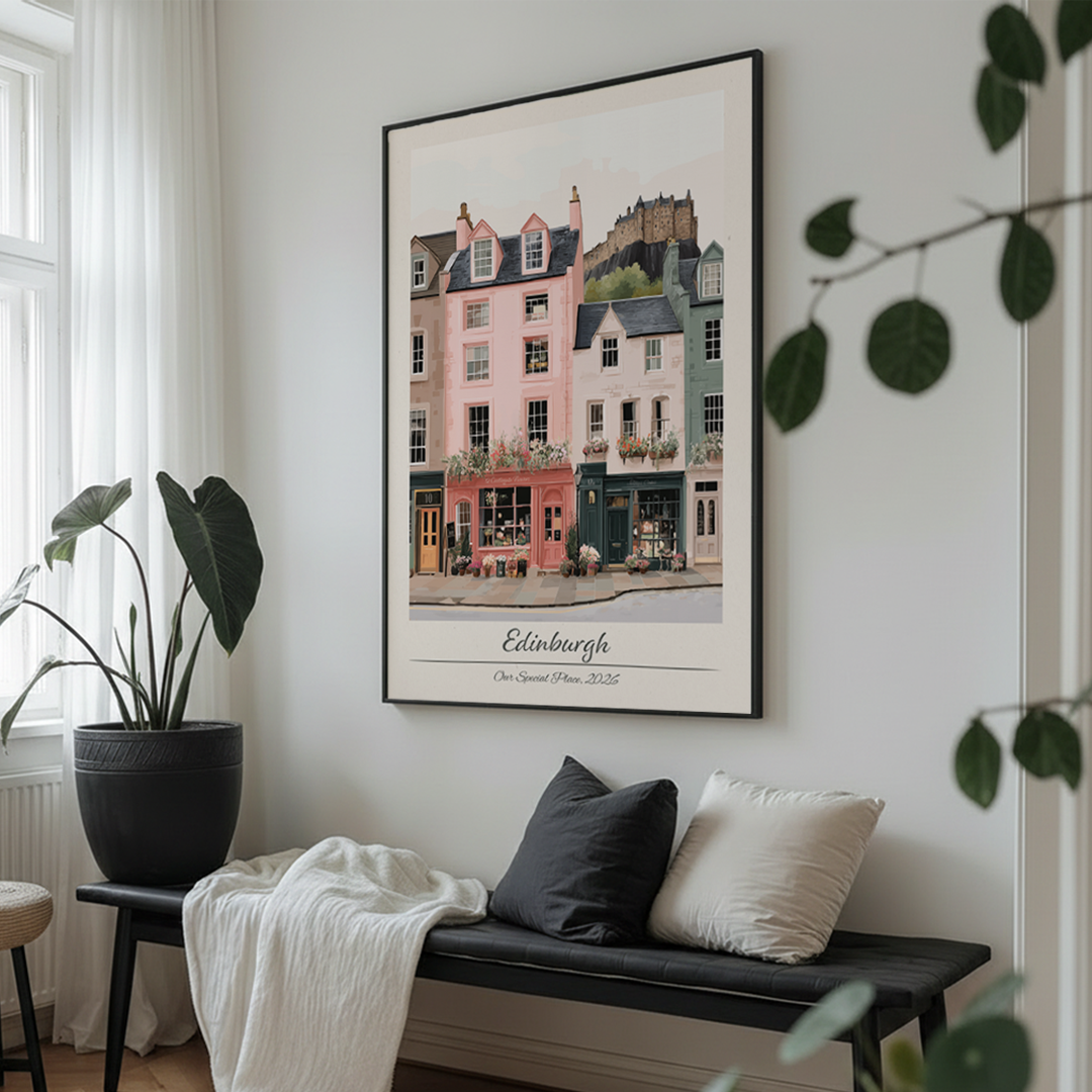 Framed artwork of Edinburgh on a wall above a bench with cushions.