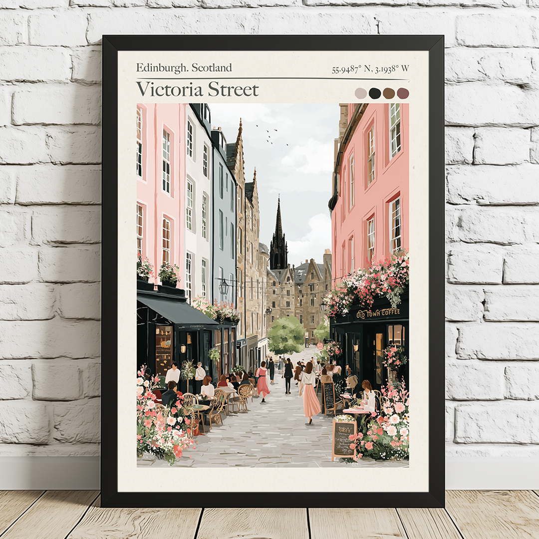 Framed artwork of Victoria Street in Edinburgh, Scotland, with a white brick wall background.