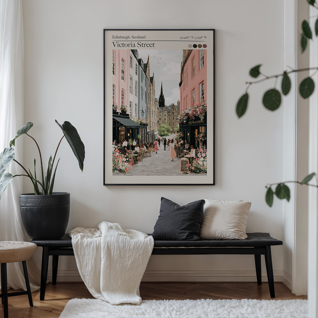 Living room with a bench, plant, and framed artwork on the wall.