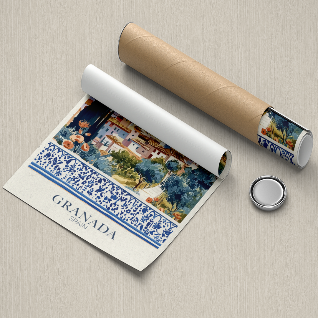 Roll of paper with a scenic design and 'Granada Spain' text, next to a cylindrical container and small round object on a beige background.