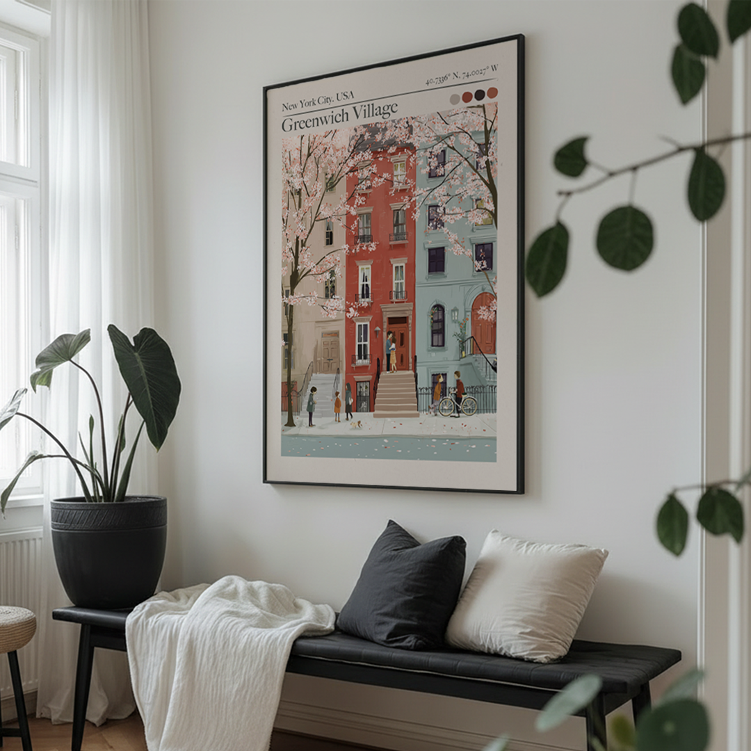 Framed artwork of Greenwich Village in New York City on a wall above a bench with cushions.