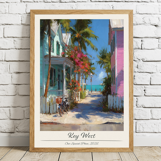 Framed artwork of a tropical street scene with houses and palm trees, titled 'Key West'.