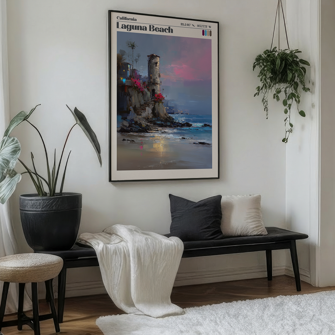Living room with a bench, cushions, and a framed poster of Laguna Beach on the wall.