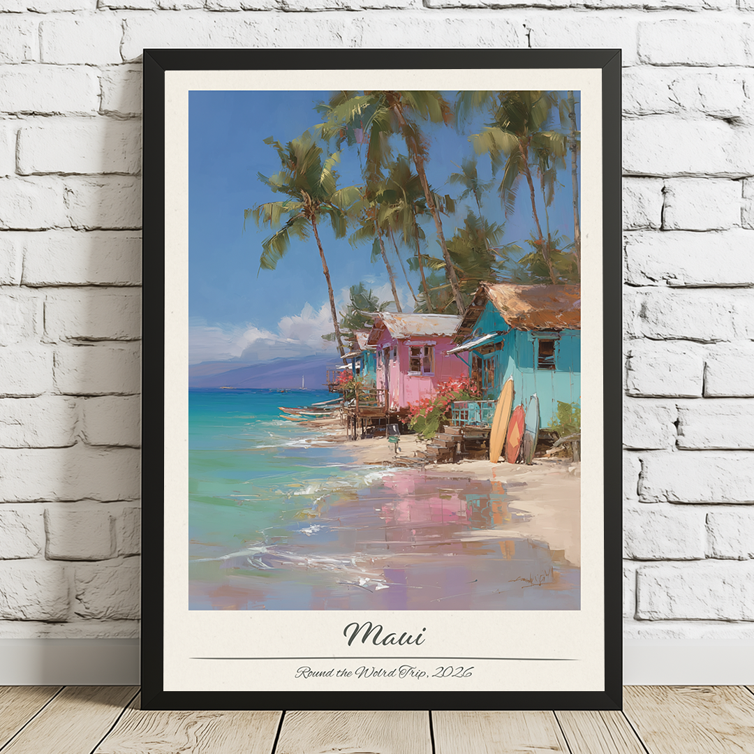 Framed artwork of a tropical beach scene with colorful houses and palm trees, titled 'Maui'.
