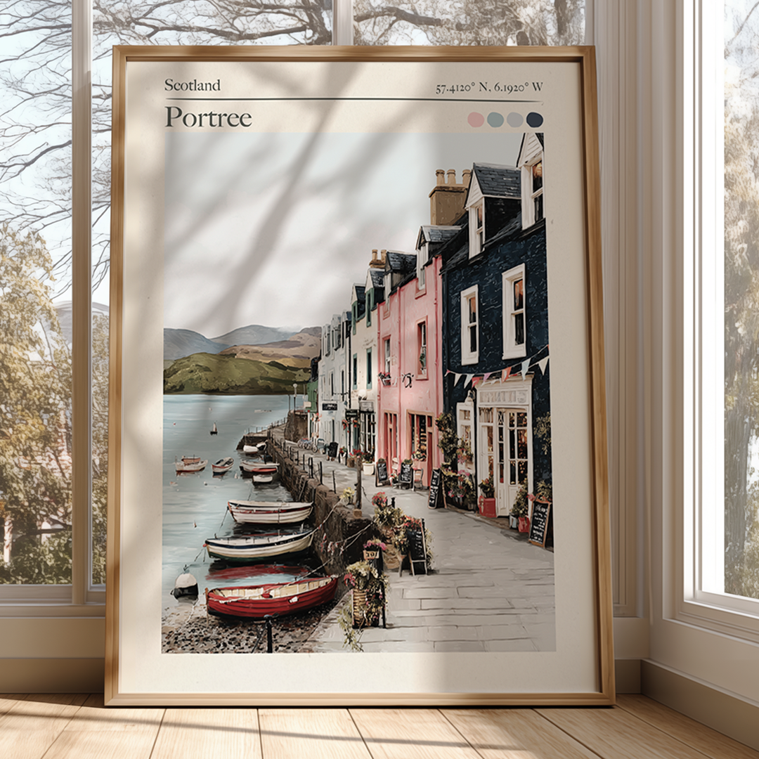 Framed artwork of a scenic street in Portree, Scotland, with boats and buildings.