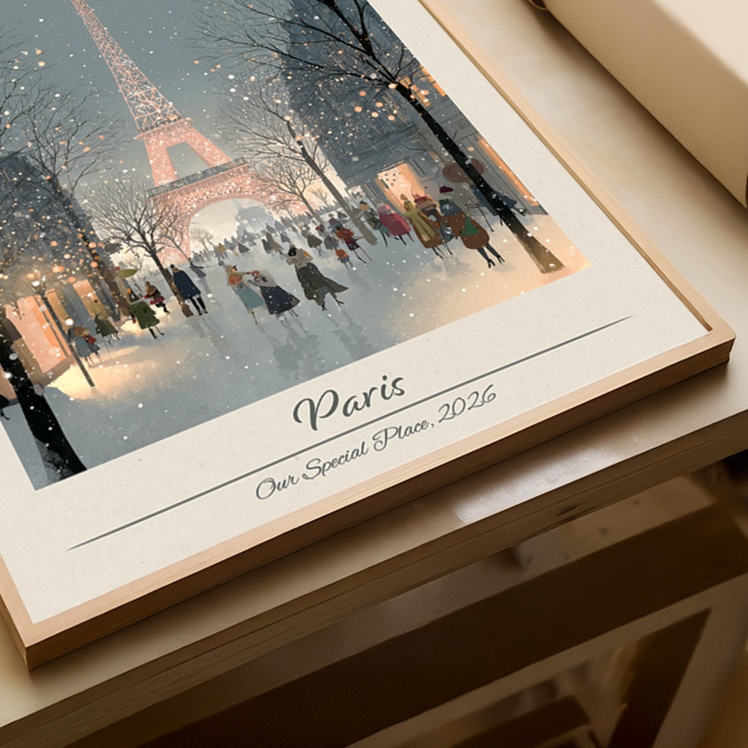 Framed artwork of the Eiffel Tower in Paris with people walking around, titled 'Paris: Our Special Place, 2026'.