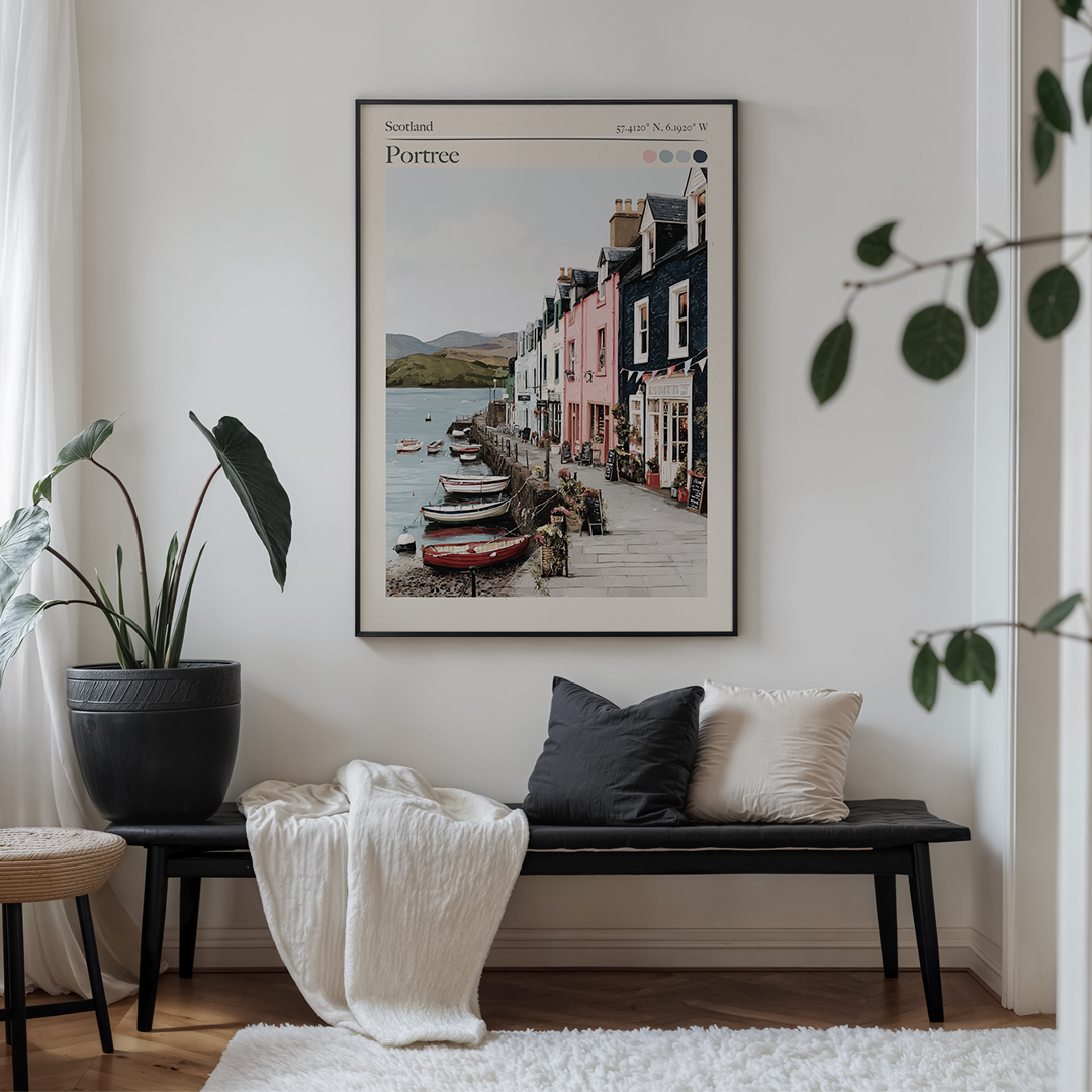 Living room with a framed print of Portree, Scotland on the wall above a bench.