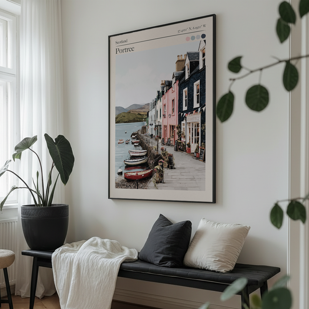Framed artwork of a coastal scene on a wall above a bench with cushions.