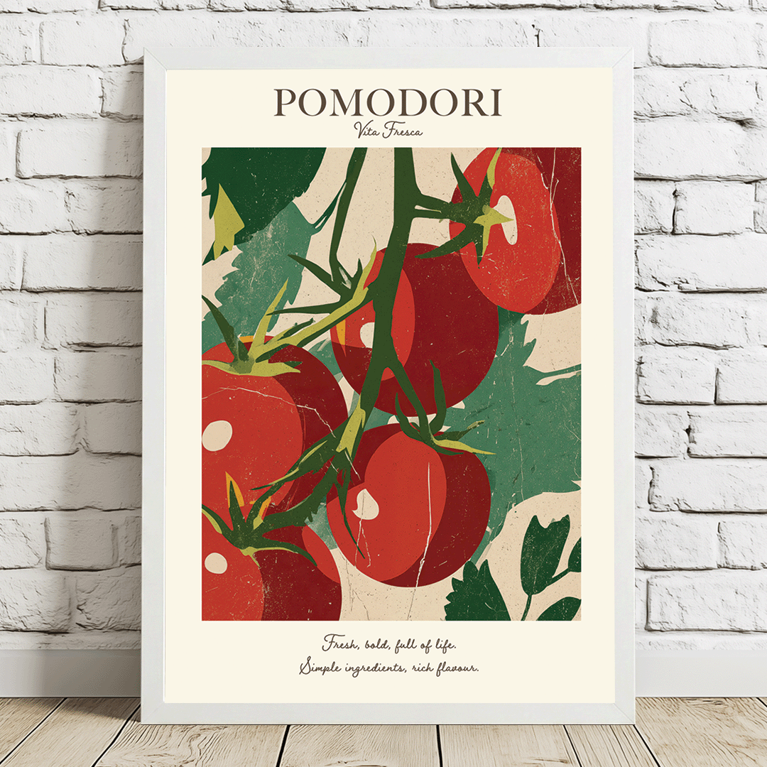 A framed vintage-style poster featuring red tomatoes on the vine with the title 'POMODORI' at the top, leaning against a white brick wall on a light wood floor.