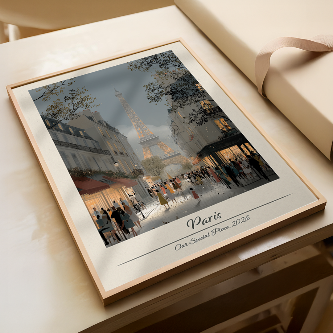 Framed artwork of Paris with Eiffel Tower on a wooden surface