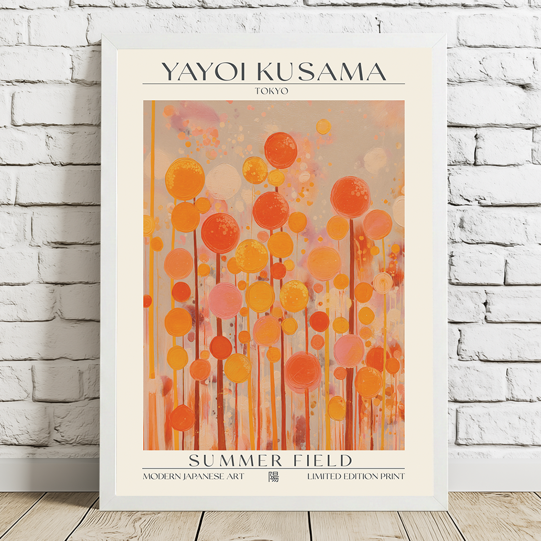 Framed Yayoi Kusama art print titled 'Summer Field' on a white brick wall.