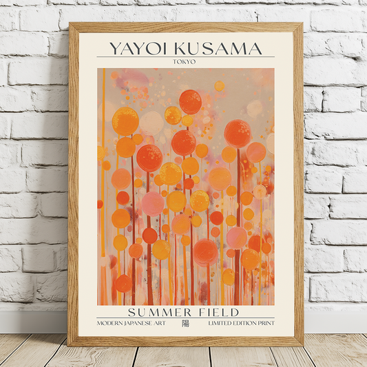 Framed Yayoi Kusama art print titled 'Summer Field' on a white brick wall.
