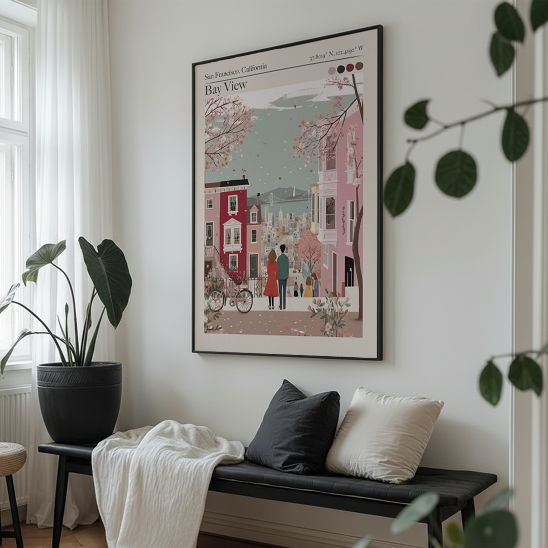 Framed artwork of a city scene on a wall above a bench with cushions.