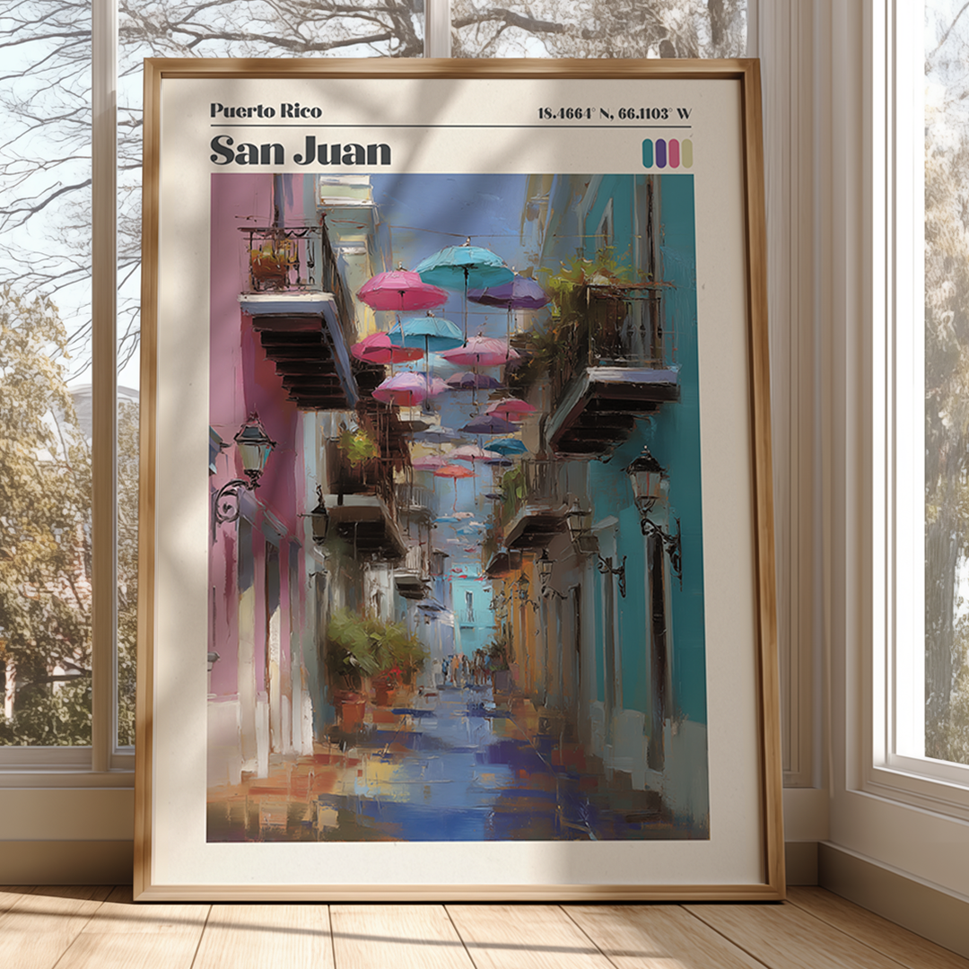 Framed artwork of a colorful street scene in San Juan, Puerto Rico, with umbrellas and buildings.