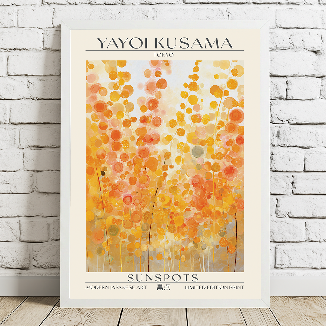 Framed Yayoi Kusama art print titled 'Sunspots' on a white brick wall