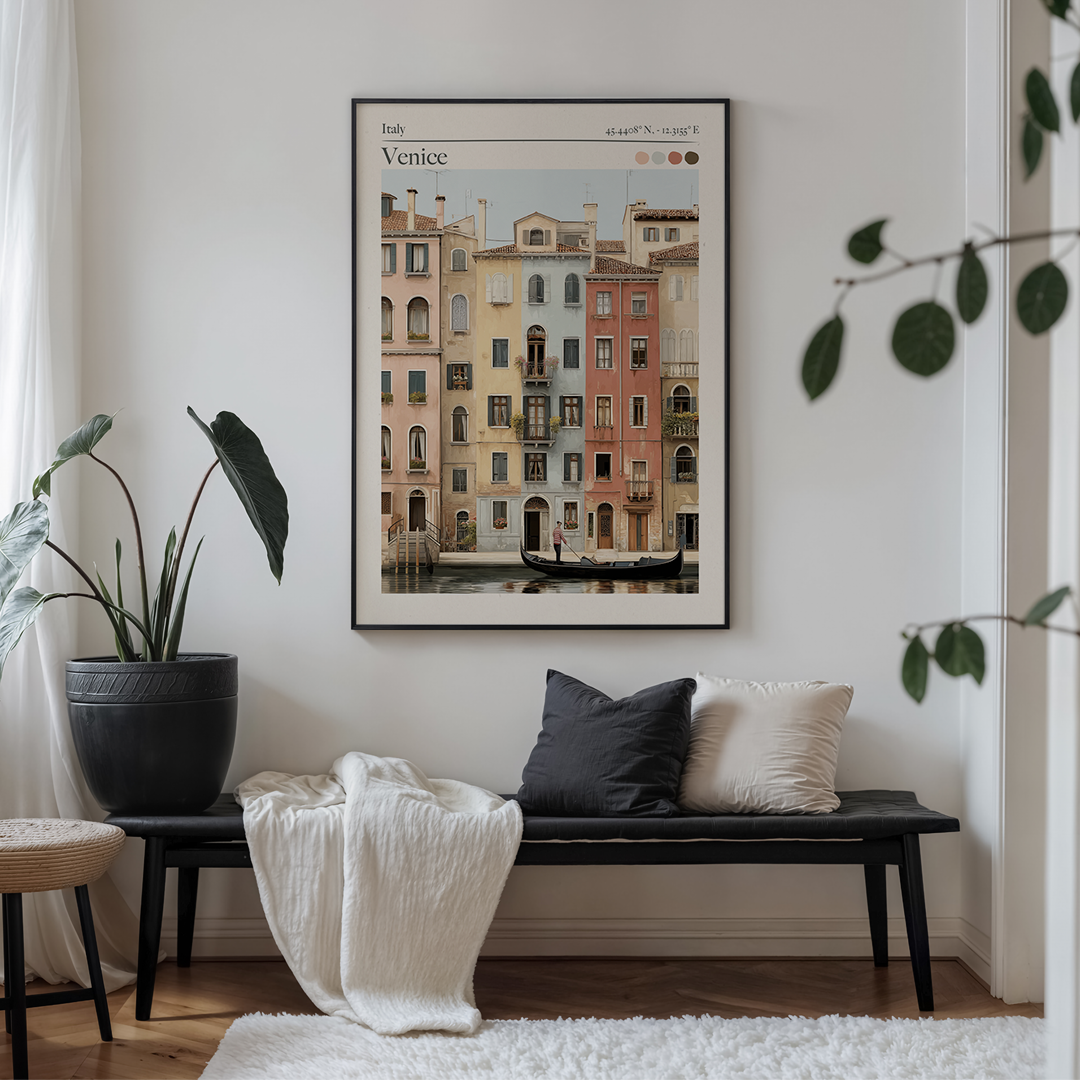 Living room with a bench, cushions, and a framed artwork of Charleston on the wall.
