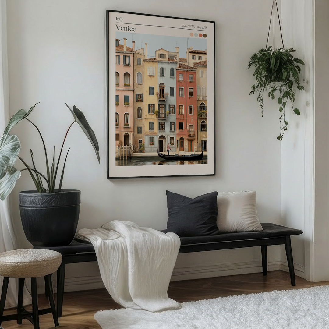 Living room with a bench, cushions, and a framed picture of Venice on the wall.