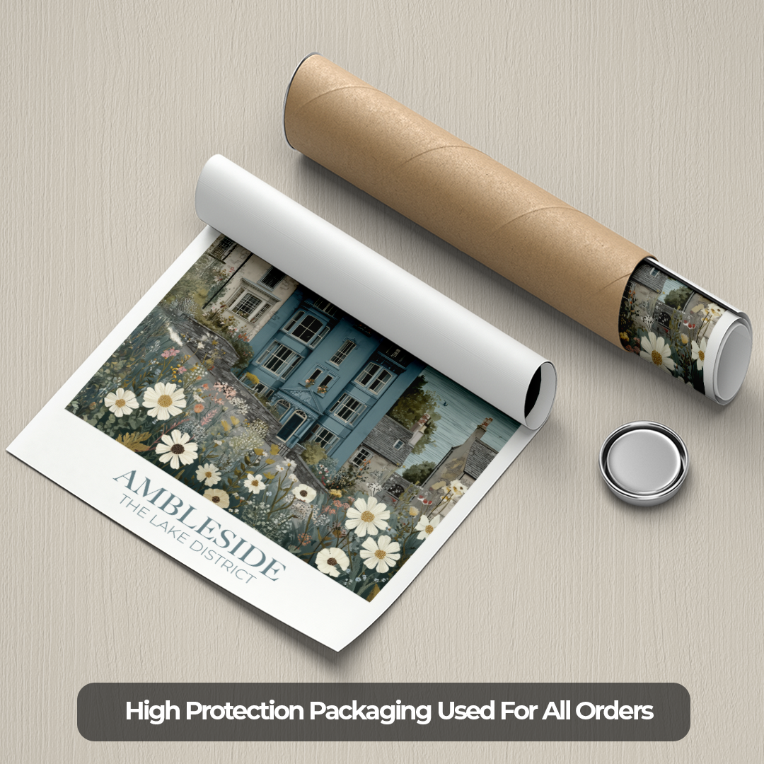 Roll of paper with a printed design of a house and flowers, accompanied by a cardboard tube and a small round object on a beige background.