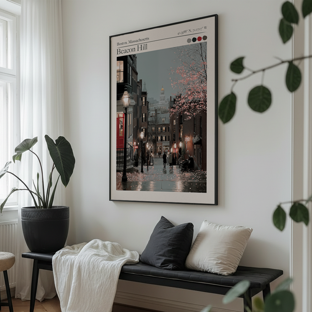Framed artwork of a city street scene on a wall above a bench with cushions.