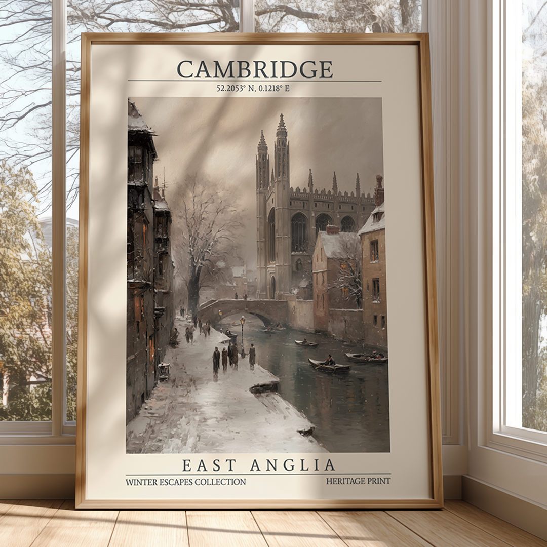 Framed print of a snowy scene in Cambridge with a river and buildings.