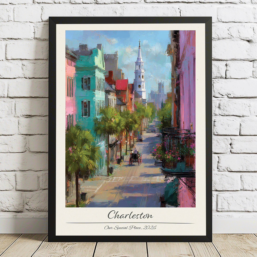 Framed artwork of a colorful street scene in Charleston on a white brick wall.