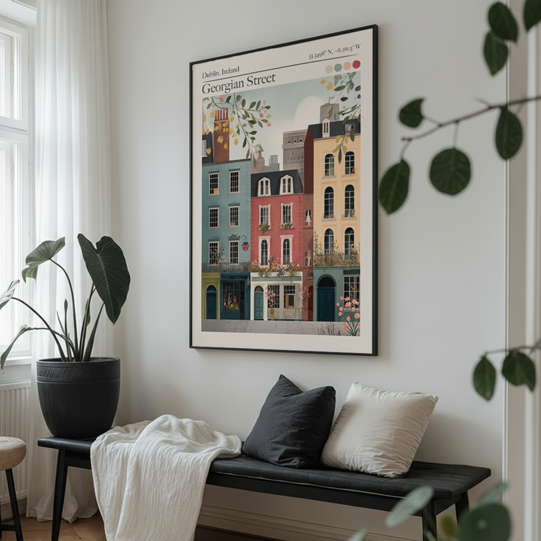 Framed artwork of a cityscape on a wall above a bench with cushions.
