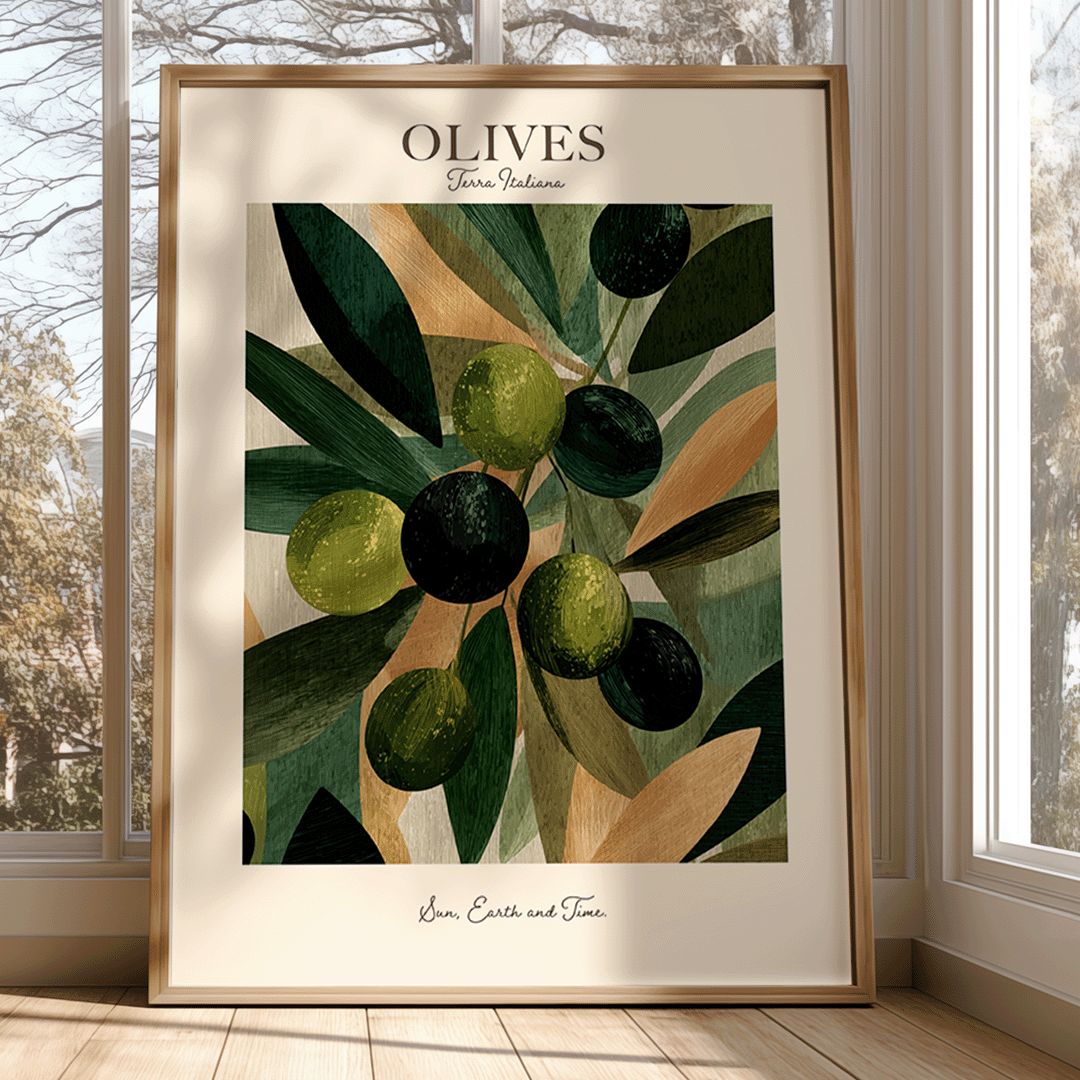A framed art print featuring an illustration of olives on branches, leaning against a window in a sunlit room. The print has a cream background with green and black olives, olive leaves, and the text 'OLIVES' at the top and 'Love, Earth and Time' at the bottom.