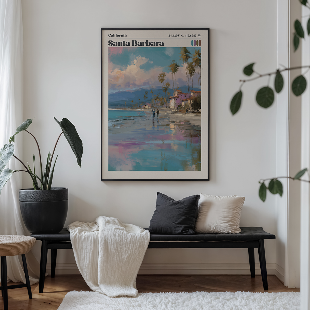 Framed artwork of Santa Barbara on a wall above a bench with cushions.