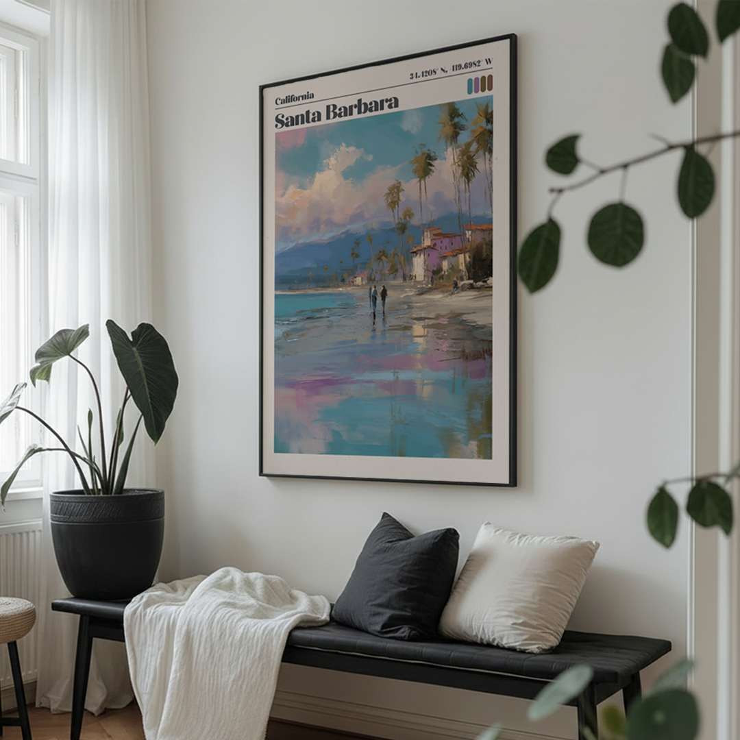 Framed artwork of Santa Barbara on a wall above a bench with cushions.